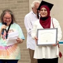 woman holding a diploma