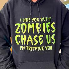 Someone wearing a sweatshirt that says "I like you, but if zombies chase us, I'm tripping you."