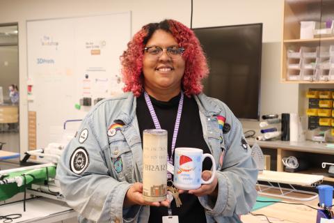 Person holding a tumbler and a mug