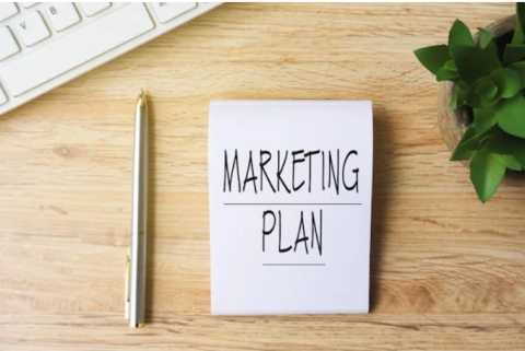 marketing plan written on notepad