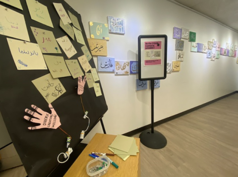 A library display of various students names written in Arabic.